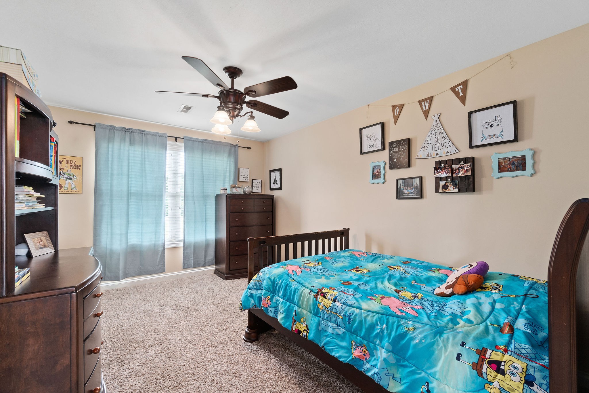 701 7 Mile Ferry Road Cunningham, TN 37052 - Photo 26 of 36 a bedroom with a bed and a chandelier