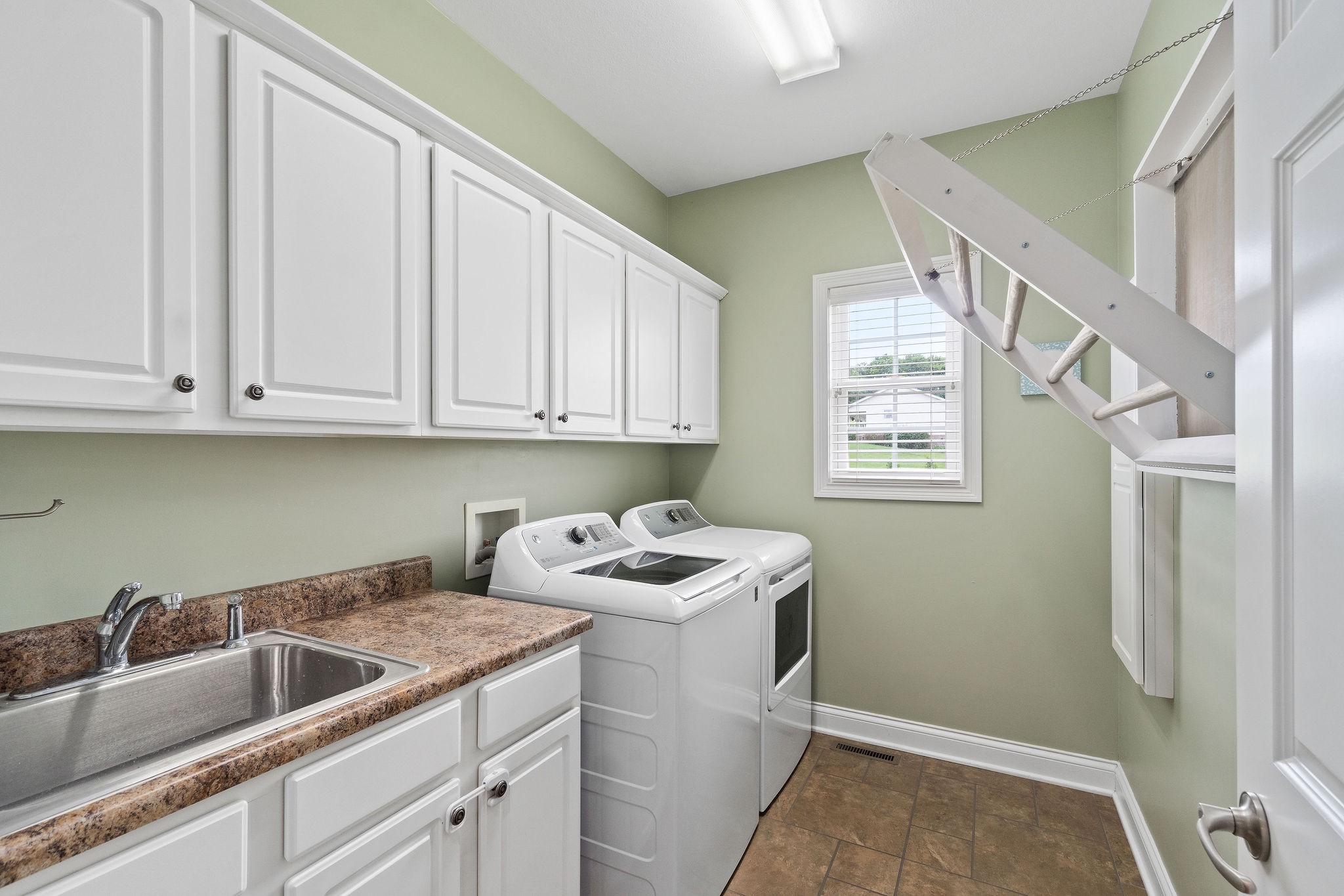 701 7 Mile Ferry Road Cunningham, TN 37052 - Photo 30 of 36 a room with storage and utility