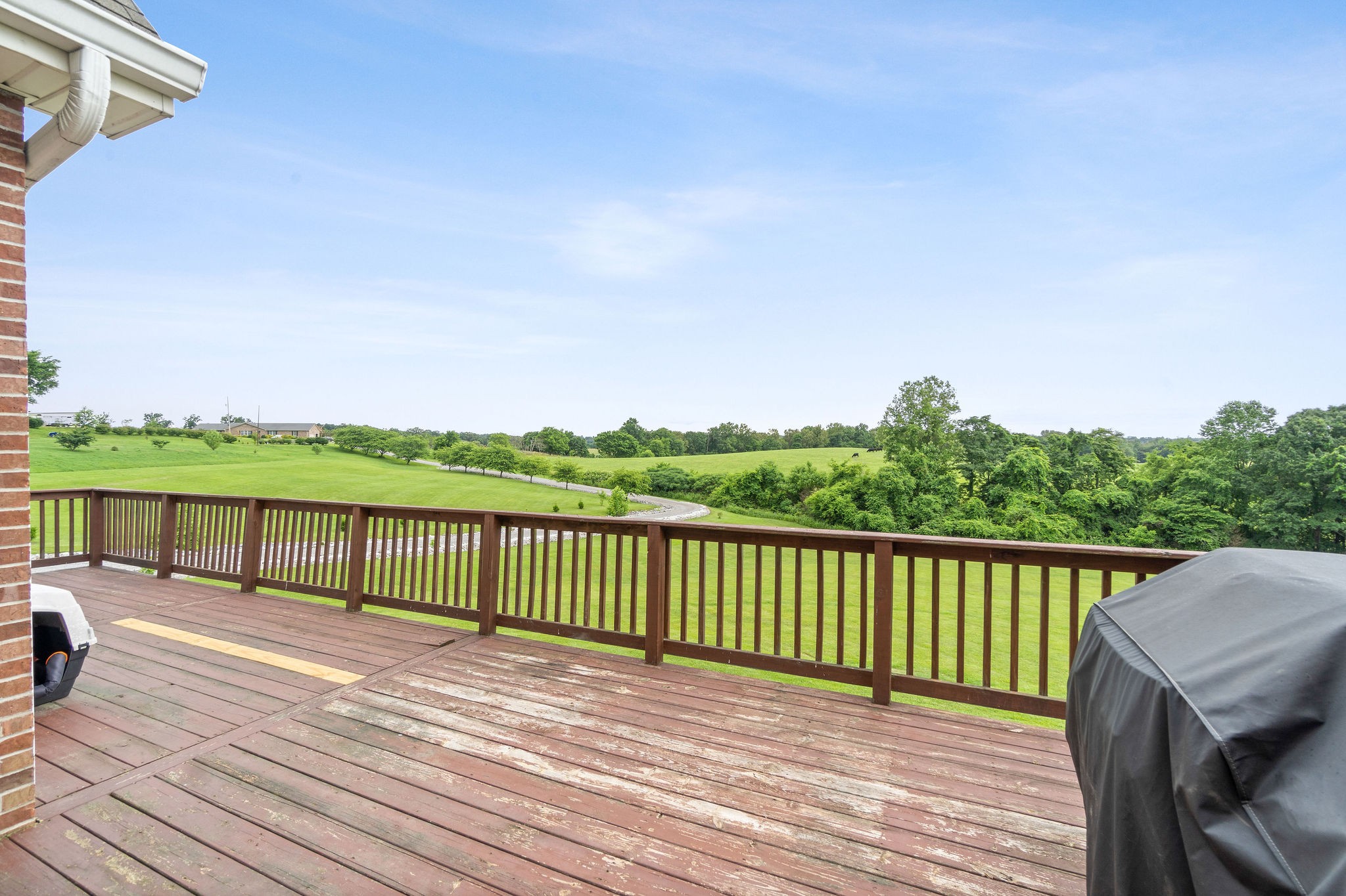 701 7 Mile Ferry Road Cunningham, TN 37052 - Photo 32 of 36 a view of a wooden deck with a yard