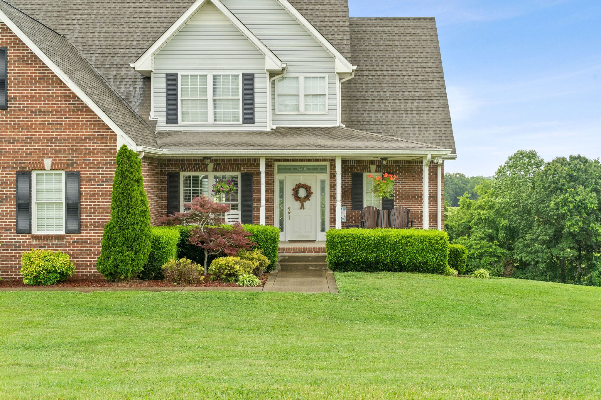 701 7 Mile Ferry Road Cunningham, TN 37052 - Photo 35 of 36 a view of a house with a yard and plants