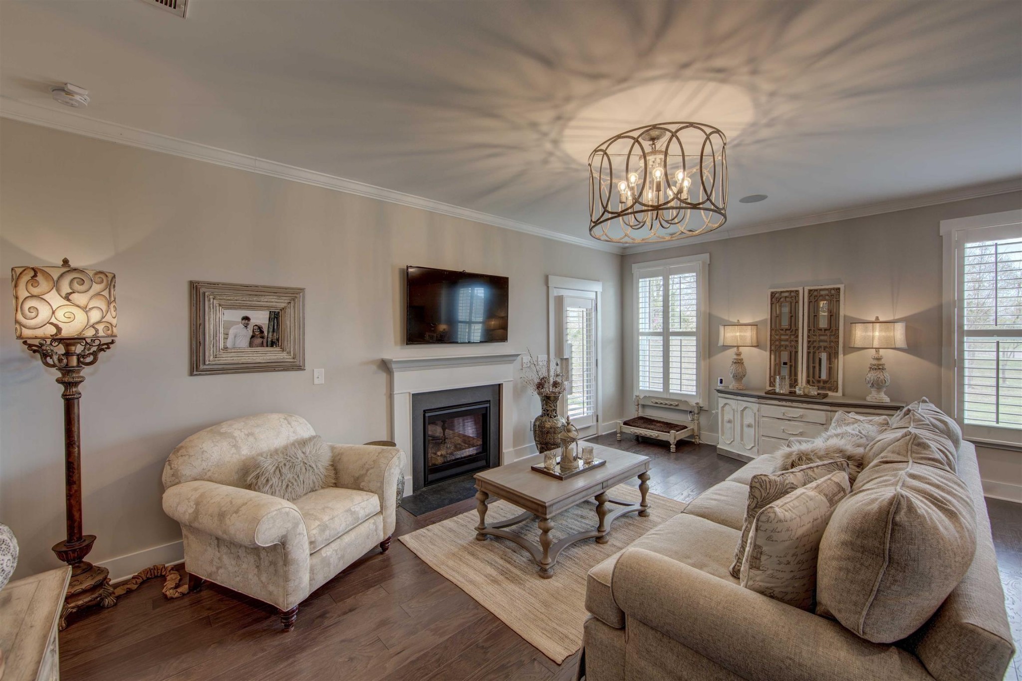 4343 Maxwell Road Antioch, TN 37013 - Photo 12 of 31 a living room with furniture a chandelier and a fireplace
