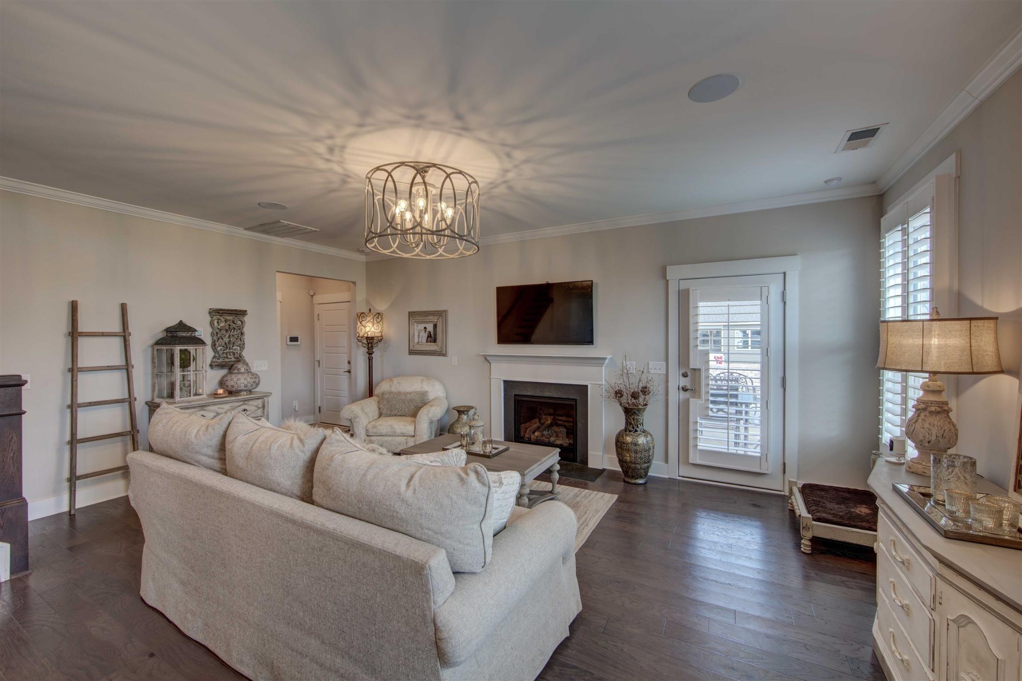 4343 Maxwell Road Antioch, TN 37013 - Photo 13 of 31 a living room with furniture a fireplace and a chandelier