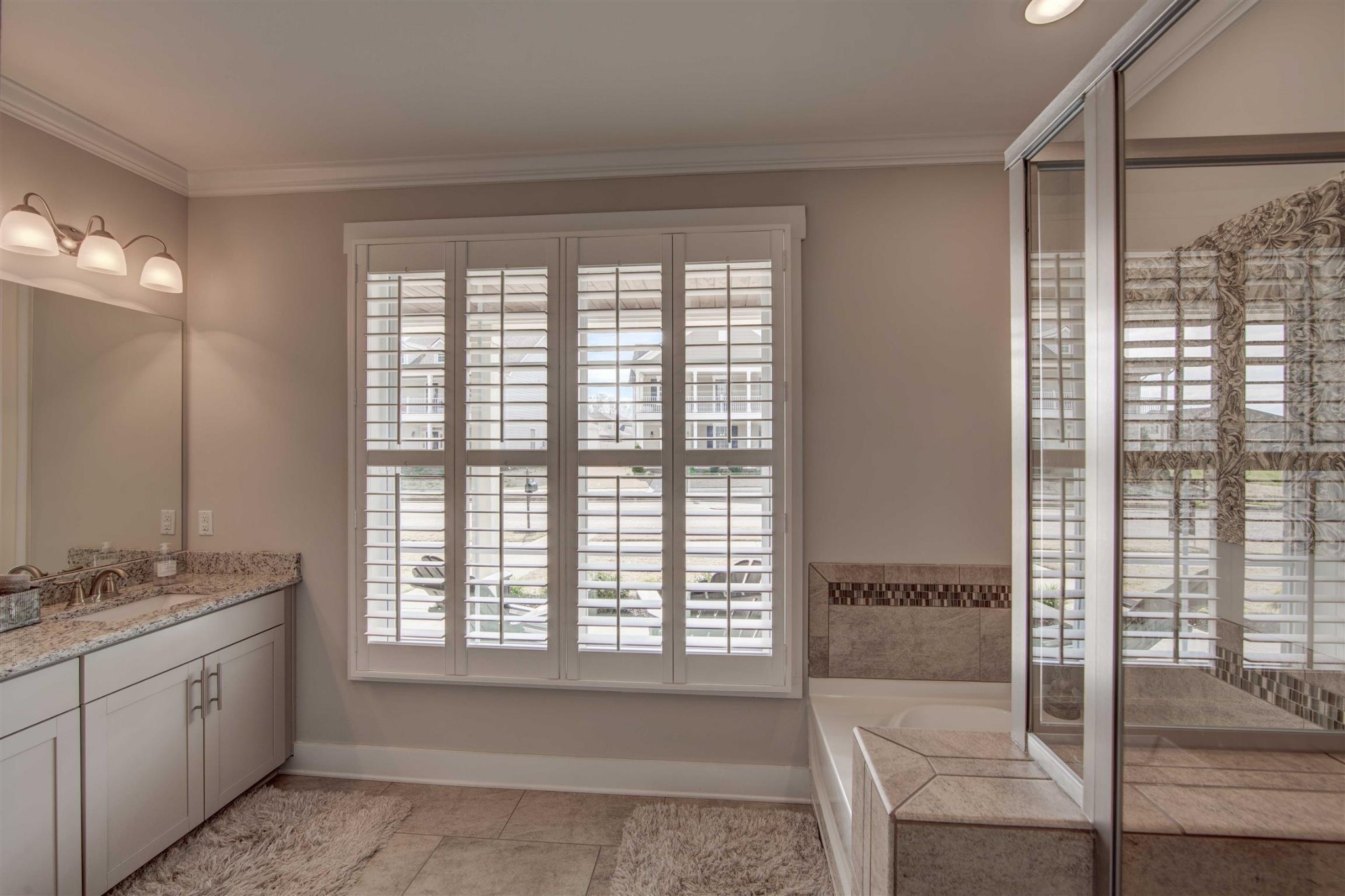 4343 Maxwell Road Antioch, TN 37013 - Photo 17 of 31 a spacious bathroom with a granite countertop tub sink and mirror