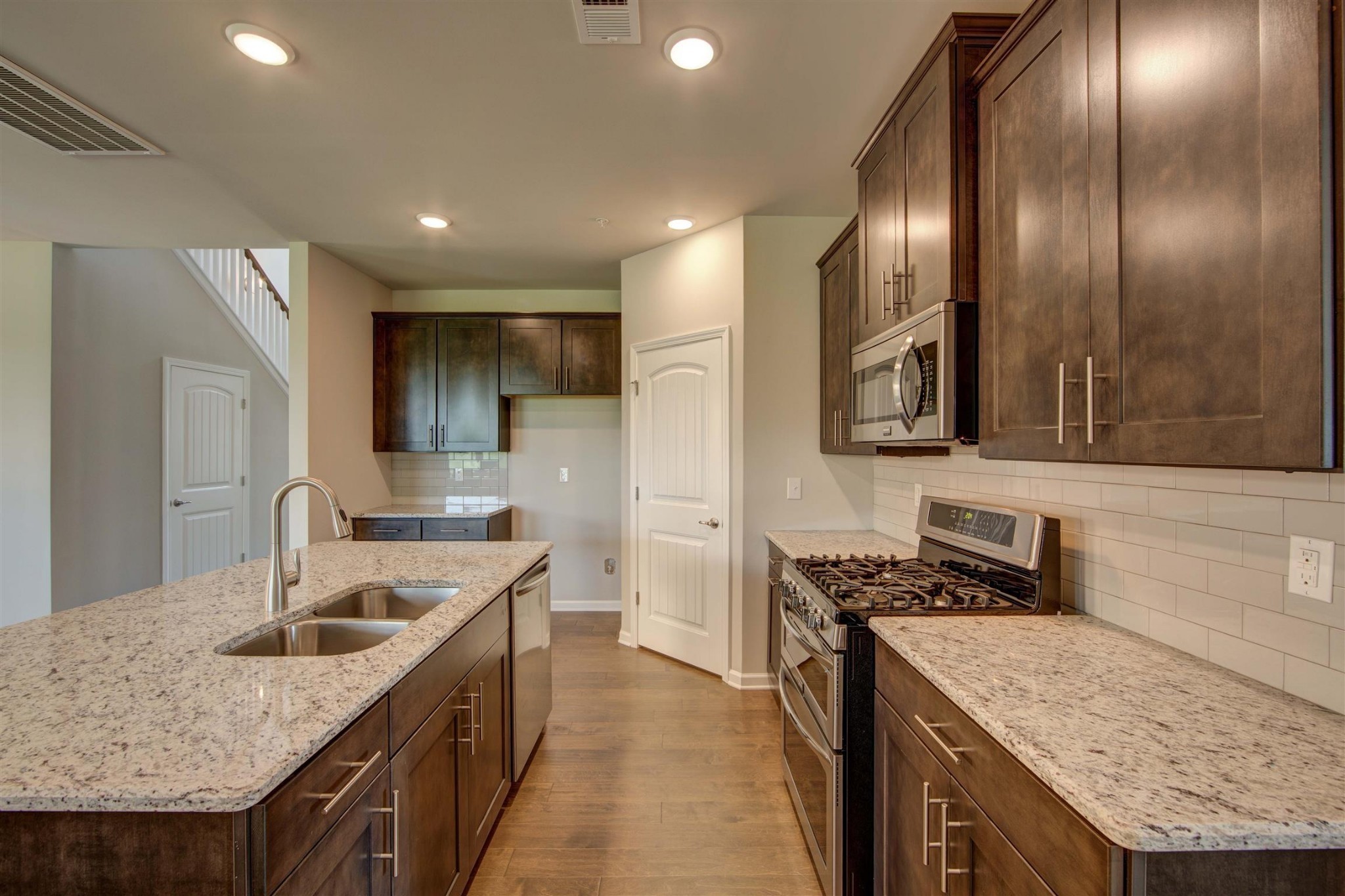 4343 Maxwell Road Antioch, TN 37013 - Photo 7 of 31 a kitchen with stainless steel appliances granite countertop a sink stove and refrigerator