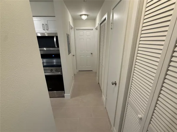 a view of an empty room with a window