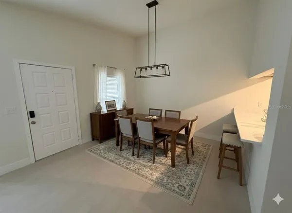 a bedroom with a bed and a potted plant