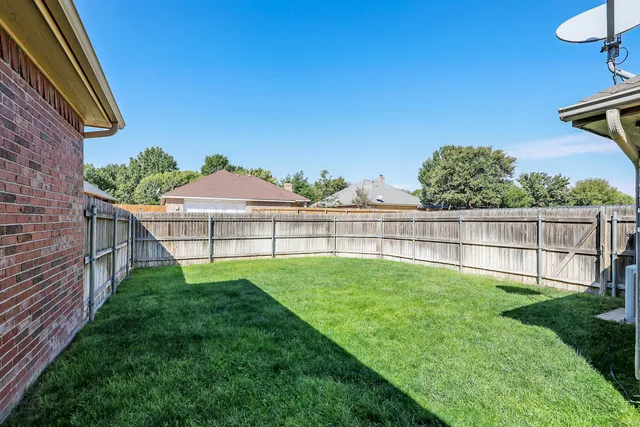 a view of backyard with green space