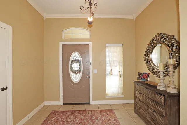 a view of a livingroom with wooden floor windows and a mirror
