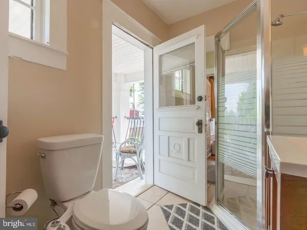 a picture of a bench in front of a door