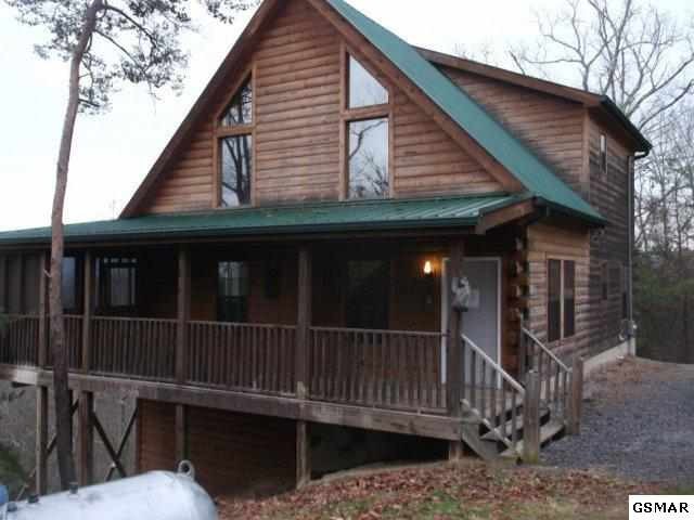 1714 Pine Grove Road Sevierville, TN 37876 - Photo 1 of 1 a view of a house with wooden deck and furniture