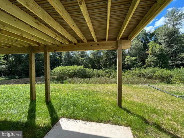 a view of a balcony with wooden floor