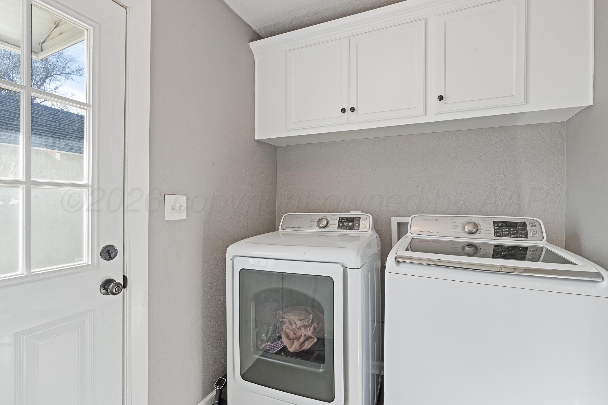 104 South Cherry Street Claude, TX 79019 - Photo 16 of 22 a utility room with dryer and washer