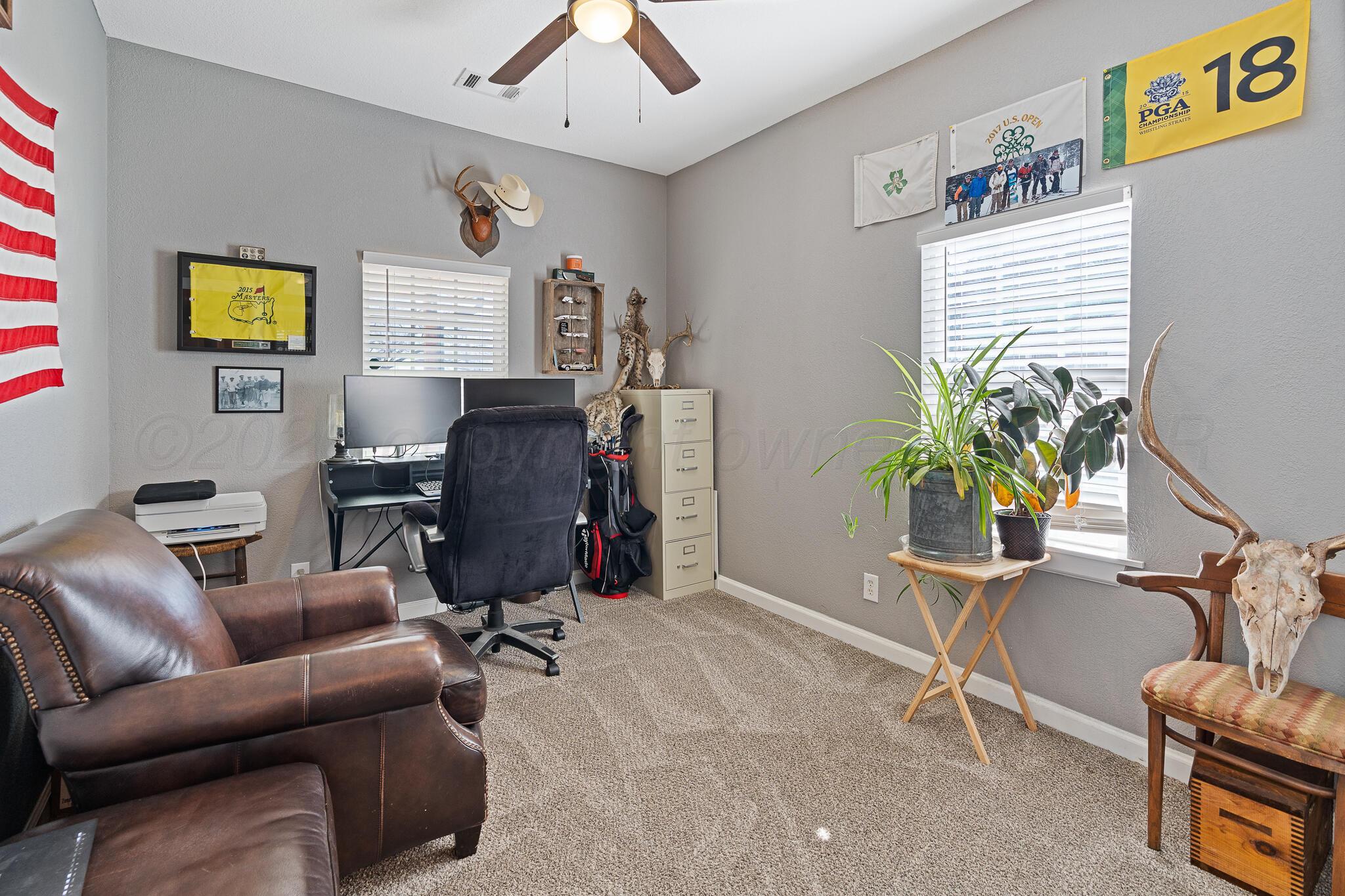 104 South Cherry Street Claude, TX 79019 - Photo 21 of 22 a livingroom with workspace couch and a window