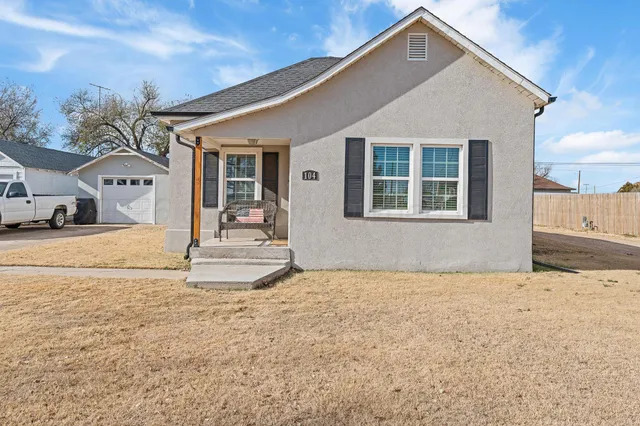 a front view of a house with a outdoor space