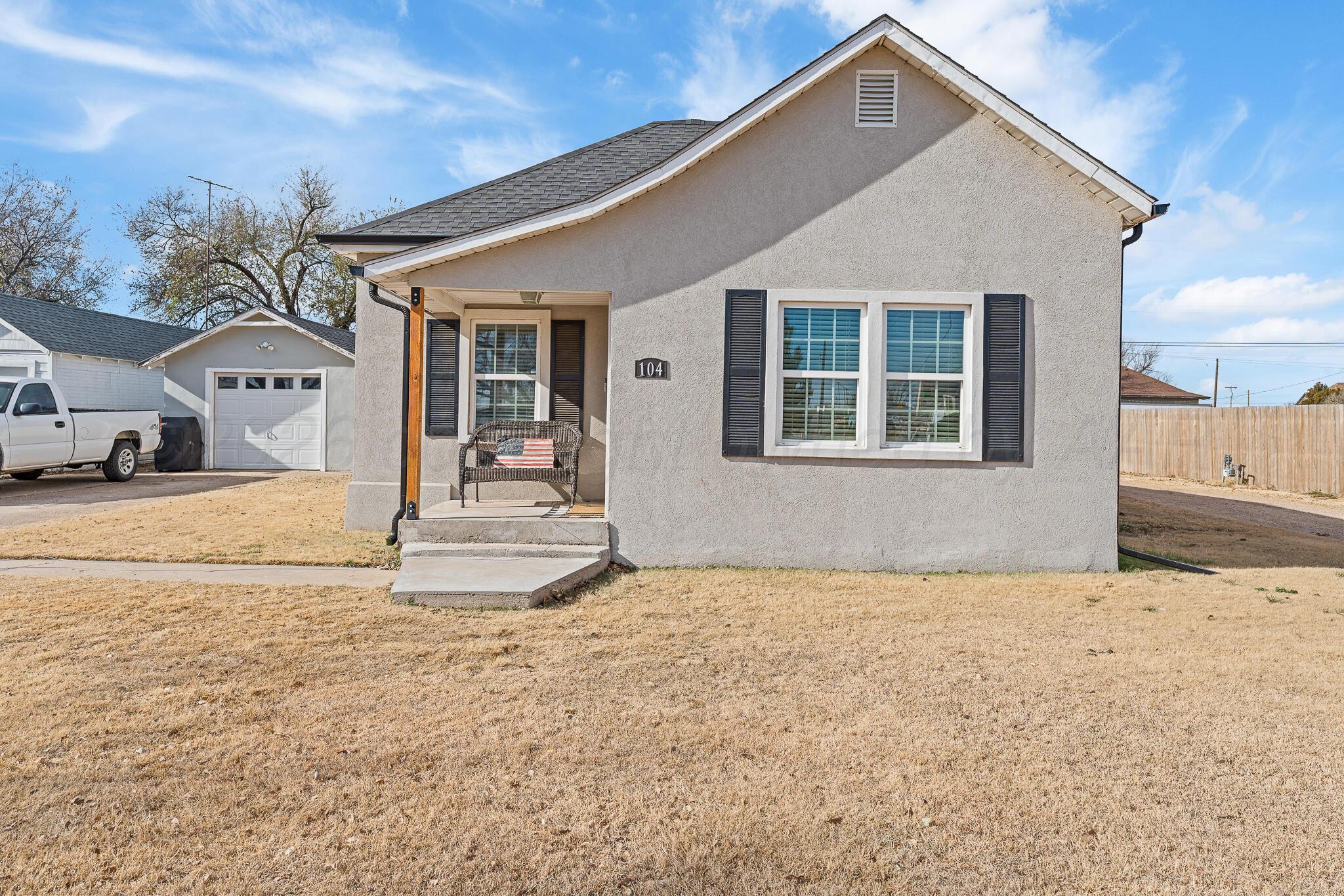 104 South Cherry Street Claude, TX 79019 - Photo 3 of 22 a front view of a house with a outdoor space