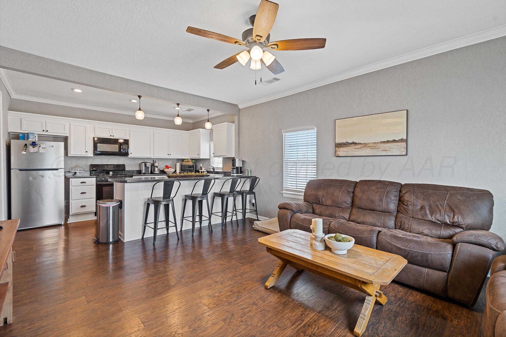 104 South Cherry Street Claude, TX 79019 - Photo 9 of 22 a living room with furniture and kitchen view