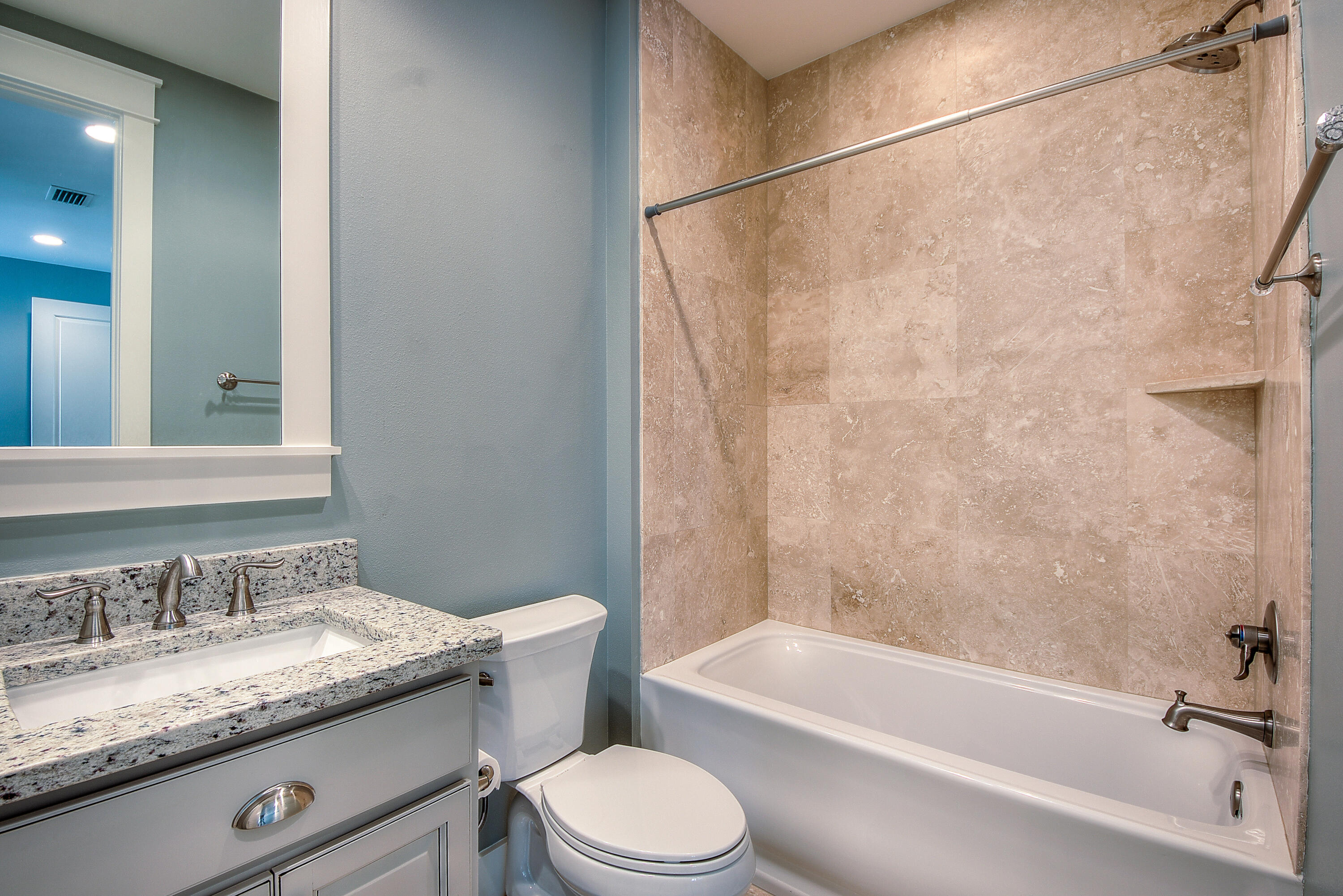 147 Jack Knife Drive Inlet Beach, FL 32461 - Photo 14 of 15 a bathroom with a granite countertop bathtub shower sink vanity mirror and toilet
