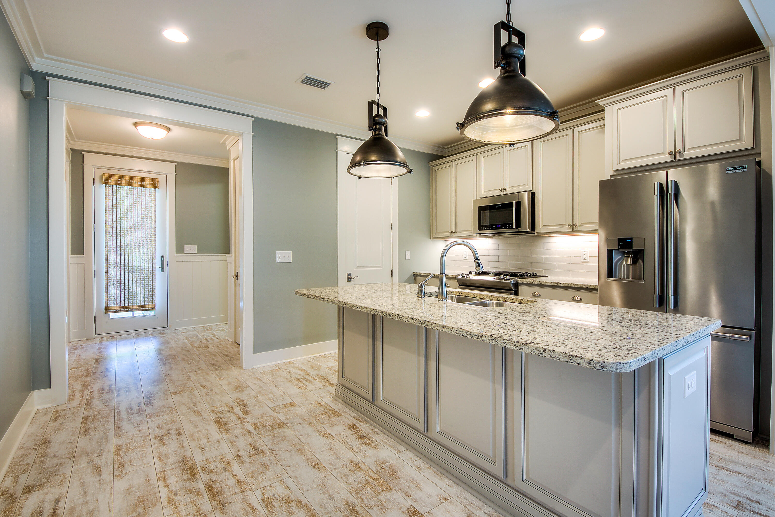 147 Jack Knife Drive Inlet Beach, FL 32461 - Photo 3 of 15 a kitchen with kitchen island a sink stainless steel appliances and counter space