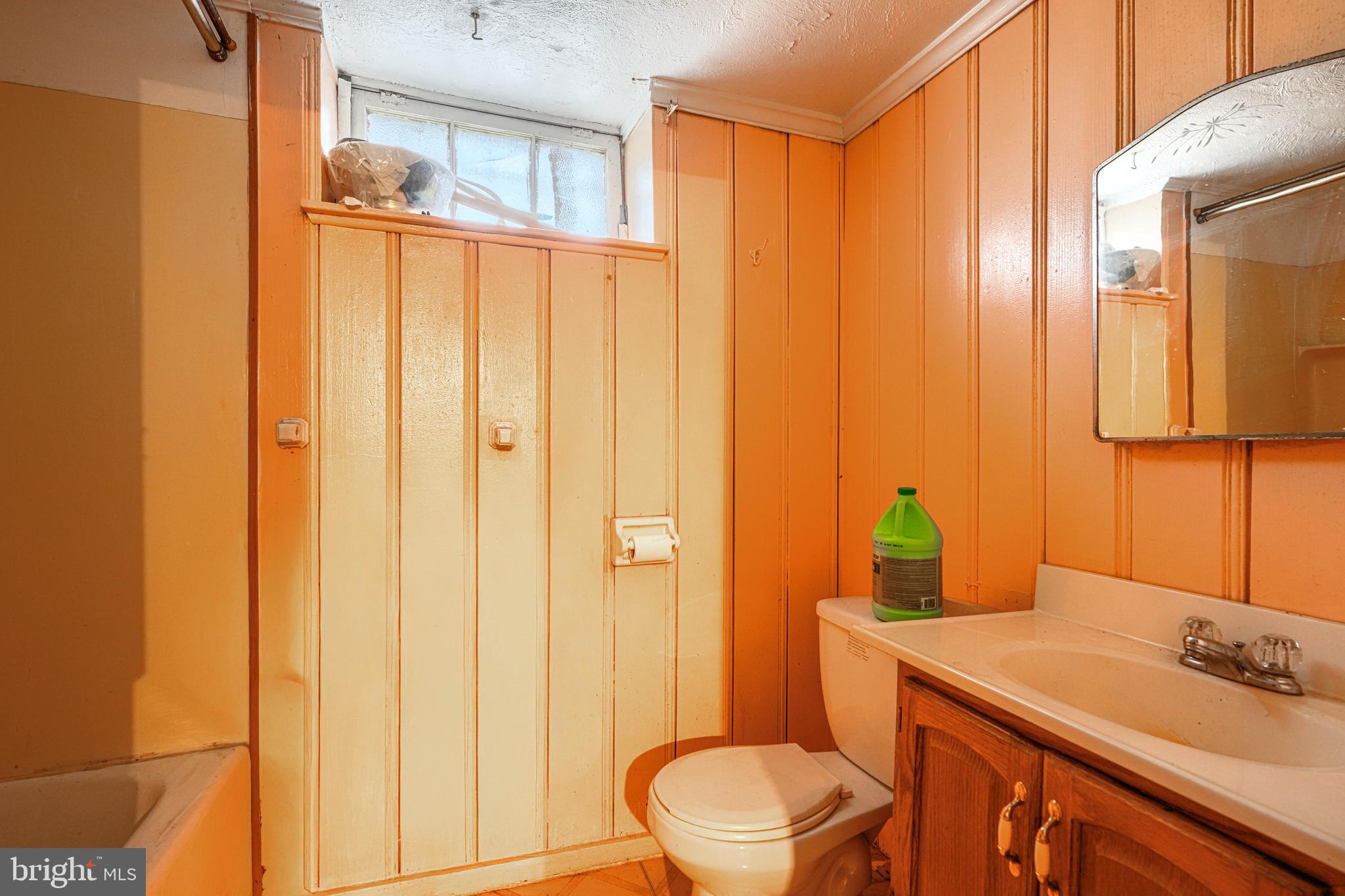 3212 Dorchester Road Baltimore, MD 21215 - Photo 43 of 45 a bathroom with a sink a toilet and shower