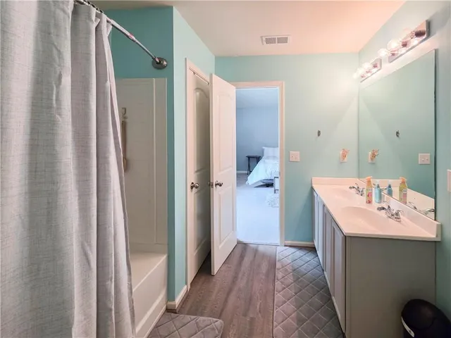 a bedroom with a bed and closet