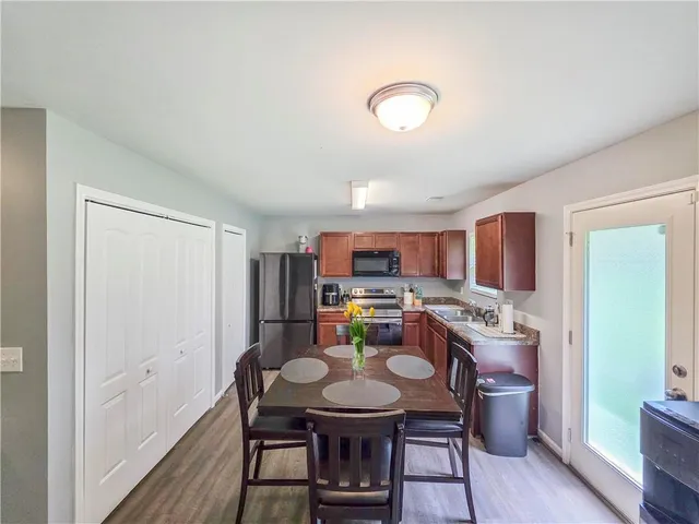 a view of a dining room with furniture window and wooden floor