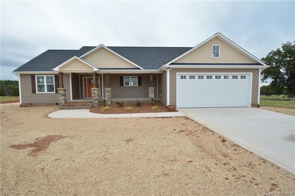 1331 George Brown Road Crouse, NC 28033 - Photo 2 of 39 a front view of a house with a yard and garage