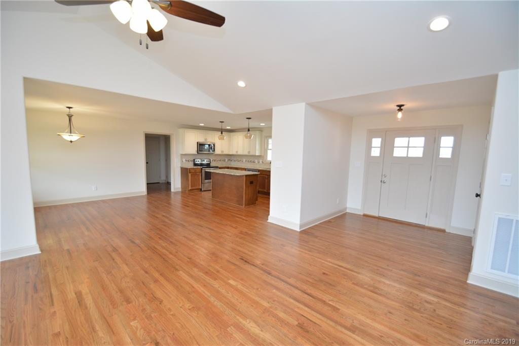 1331 George Brown Road Crouse, NC 28033 - Photo 13 of 39 a view of empty room with wooden floor and fan