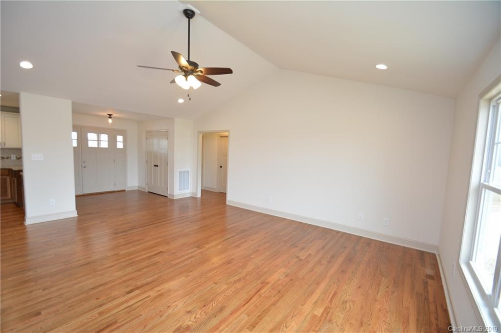 1331 George Brown Road Crouse, NC 28033 - Photo 14 of 39 a view of an empty room with wooden floor and a window