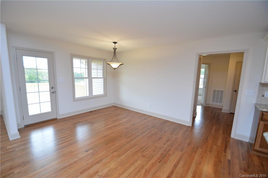 1331 George Brown Road Crouse, NC 28033 - Photo 15 of 39 an empty room with wooden floor and windows