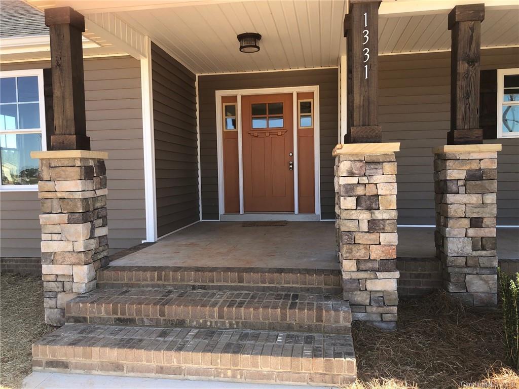 1331 George Brown Road Crouse, NC 28033 - Photo 3 of 39 a front view of a house with a yard