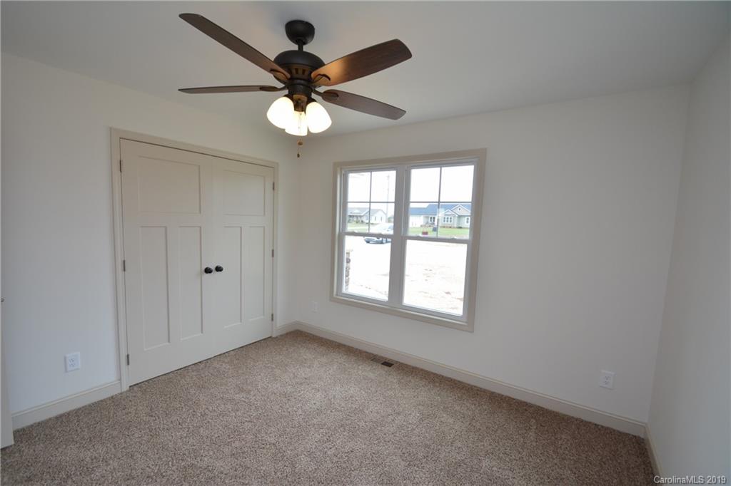 1331 George Brown Road Crouse, NC 28033 - Photo 23 of 39 an empty room with a window and a fan