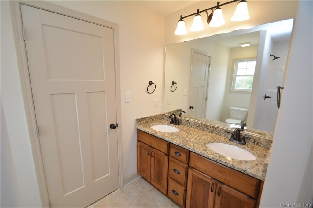 1331 George Brown Road Crouse, NC 28033 - Photo 26 of 39 a bathroom with a granite countertop sink and a mirror