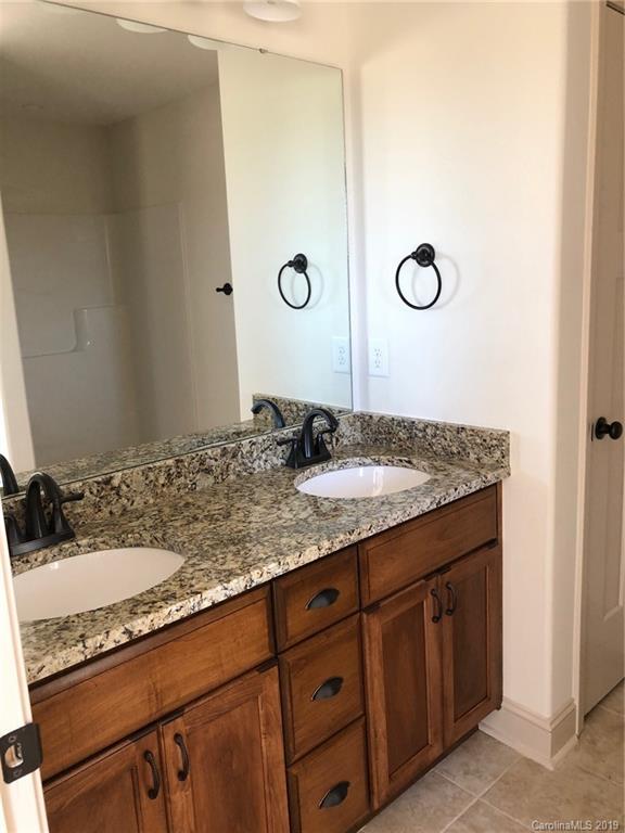 1331 George Brown Road Crouse, NC 28033 - Photo 27 of 39 a bathroom with a granite countertop sink and a mirror