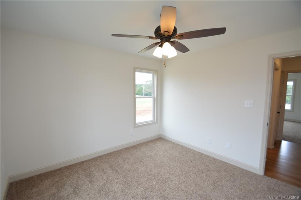 1331 George Brown Road Crouse, NC 28033 - Photo 29 of 39 an empty room with a window and a fan