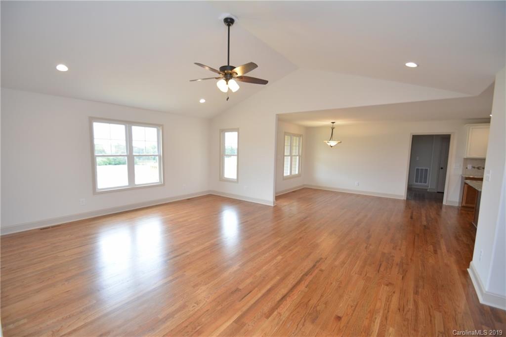 1331 George Brown Road Crouse, NC 28033 - Photo 4 of 39 a view of an empty room with wooden floor and a window