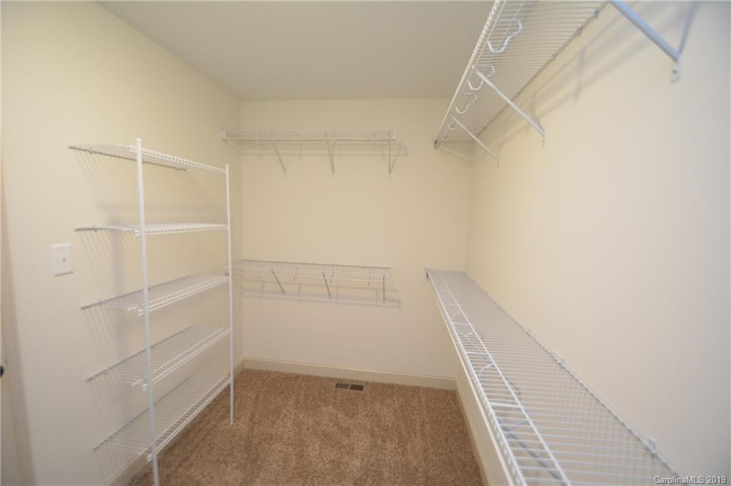 1331 George Brown Road Crouse, NC 28033 - Photo 33 of 39 a view of walk in closet with empty racks