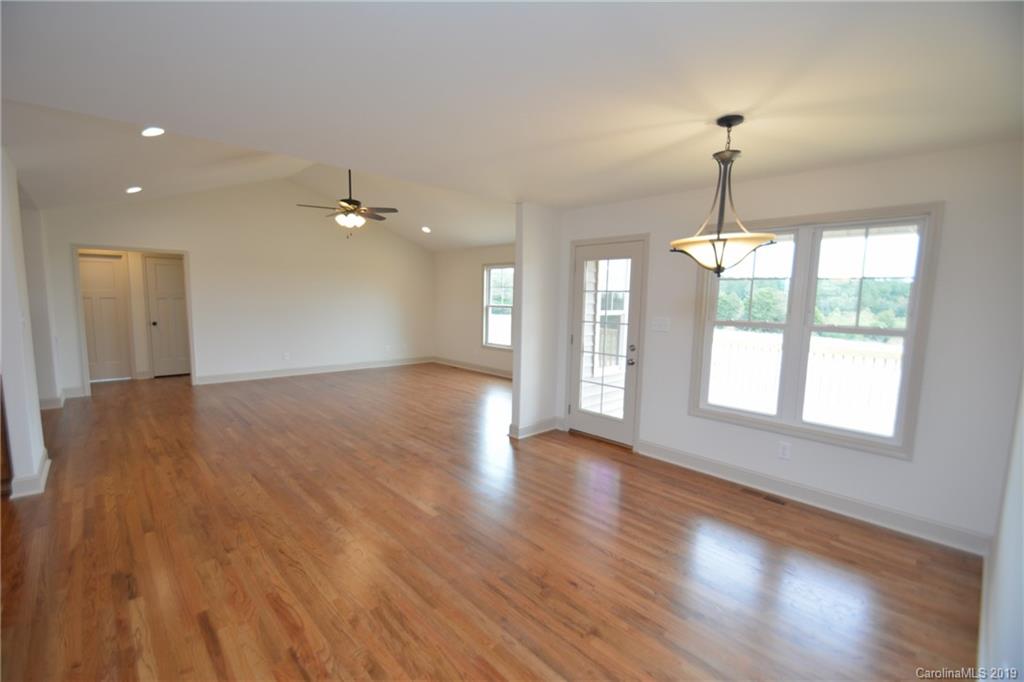 1331 George Brown Road Crouse, NC 28033 - Photo 5 of 39 a view of an empty room with wooden floor and a window