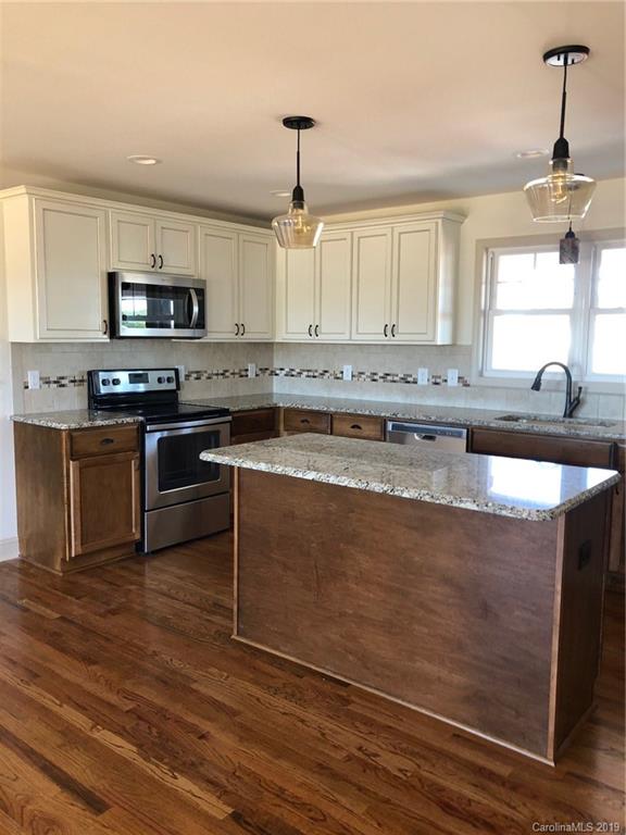 1331 George Brown Road Crouse, NC 28033 - Photo 10 of 39 a kitchen with stainless steel appliances granite countertop a stove a sink and a microwave