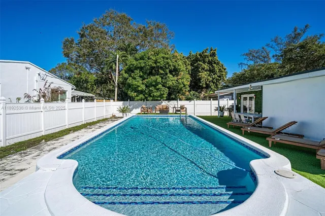 a view of a swimming pool with a patio