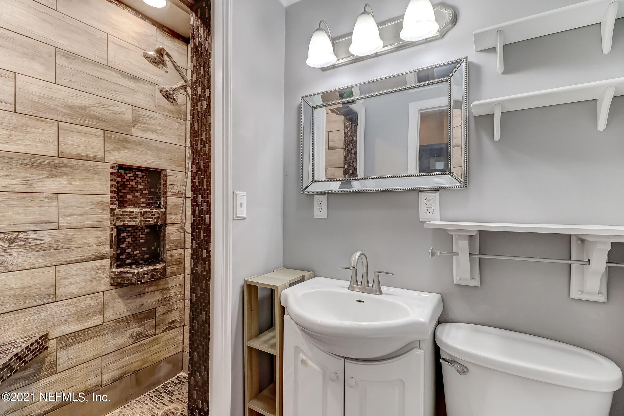 541754 Lem Turner Road Callahan, FL 32011 - Photo 14 of 27 a bathroom with a toilet sink and mirror