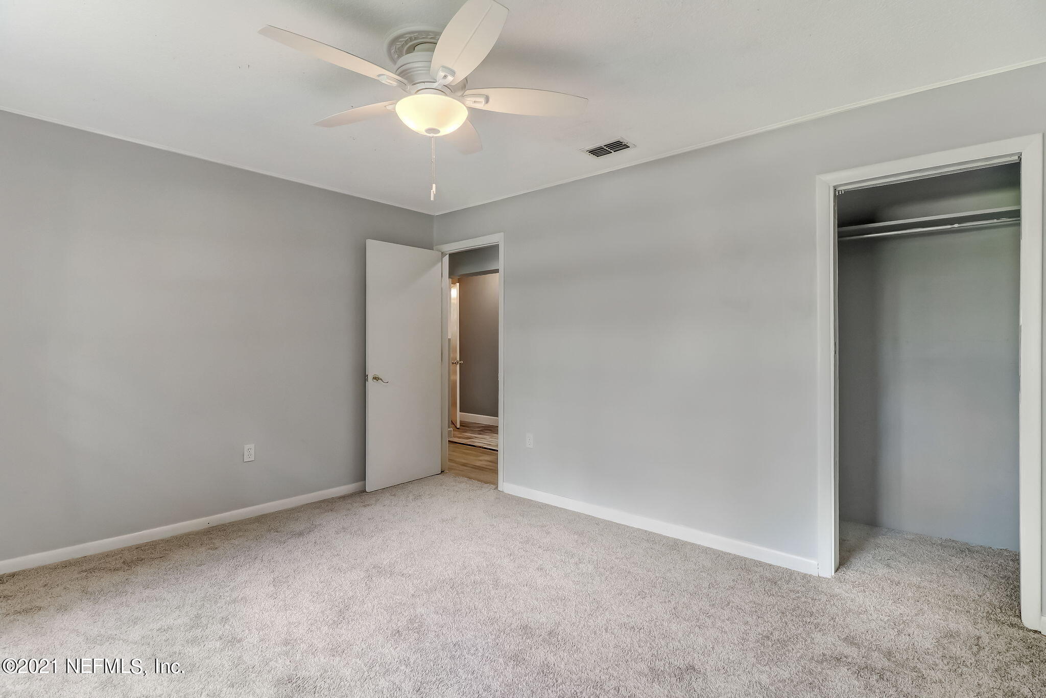 541754 Lem Turner Road Callahan, FL 32011 - Photo 15 of 27 an empty room with a ceiling fan and a fan