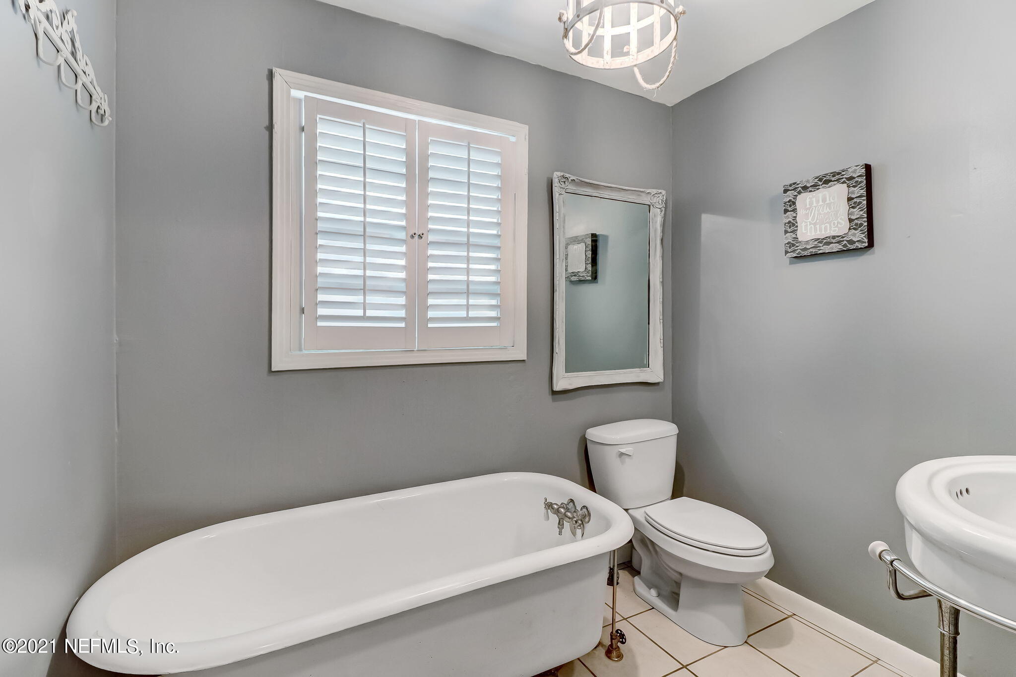 541754 Lem Turner Road Callahan, FL 32011 - Photo 17 of 27 a white toilet sitting next to a bathroom sink and tub