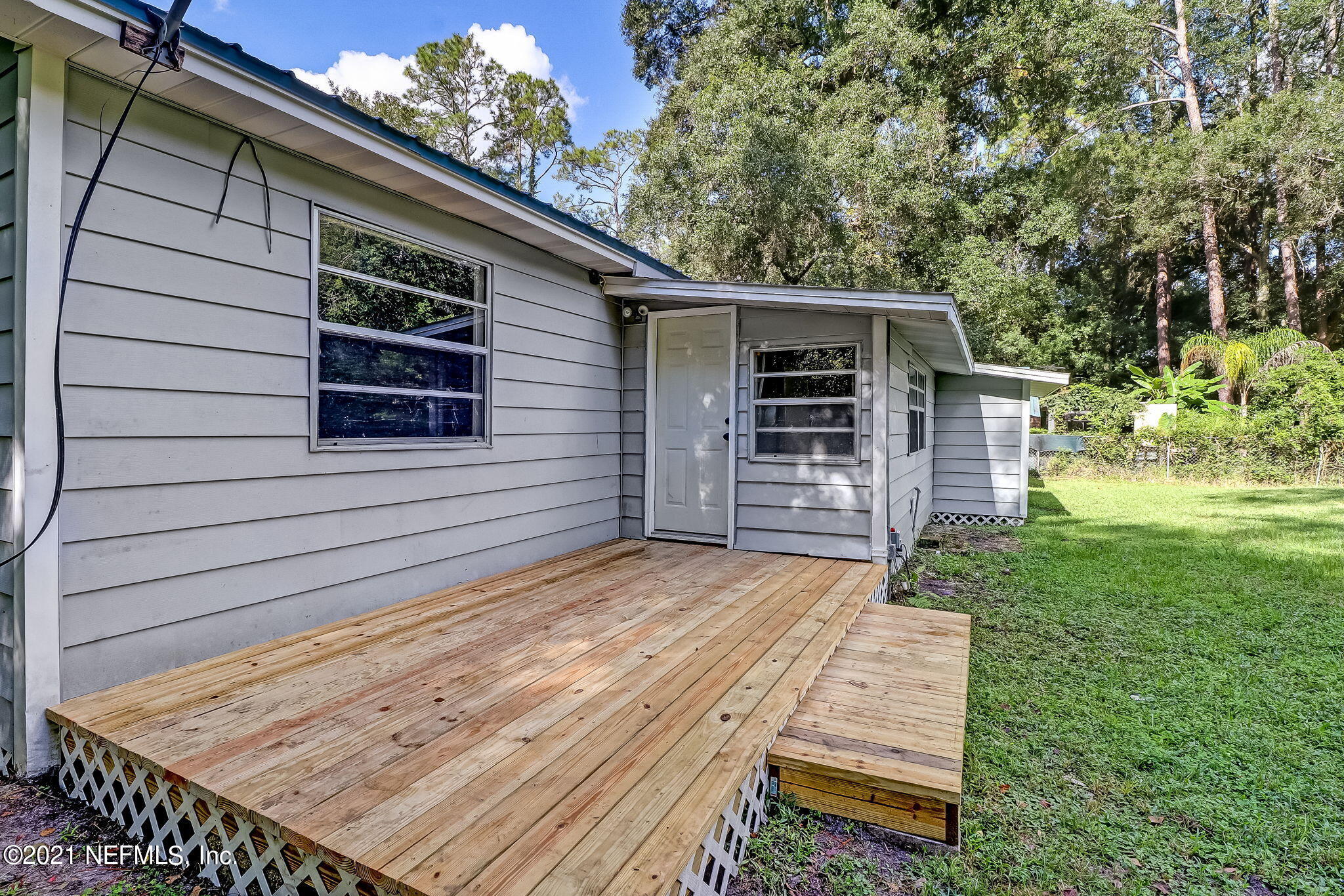 541754 Lem Turner Road Callahan, FL 32011 - Photo 23 of 27 a view of a house with a yard