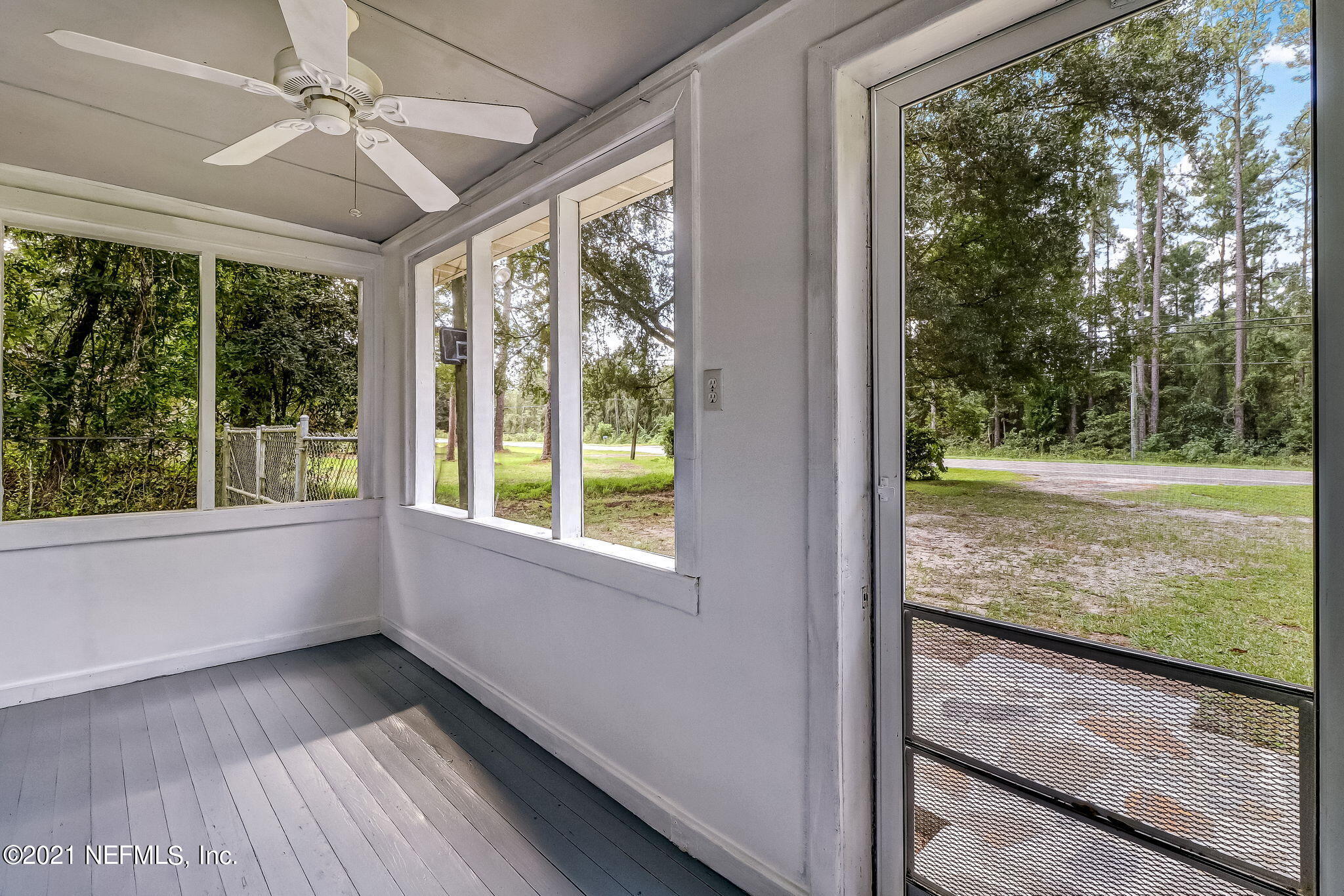 541754 Lem Turner Road Callahan, FL 32011 - Photo 4 of 27 a view of a porch with wooden floor and a yard