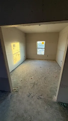 a view of an empty room and window