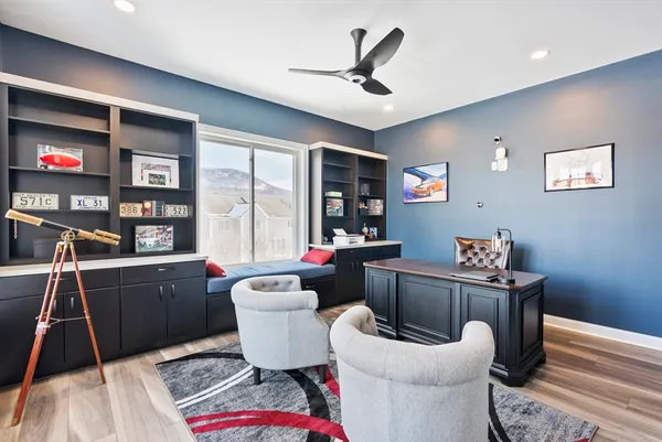 a living room with furniture a window and a bookshelf