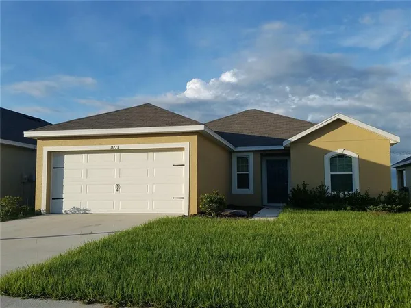 a view of a house with garden and yard