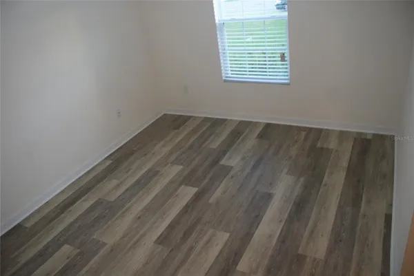 a view of a room that has a window in it