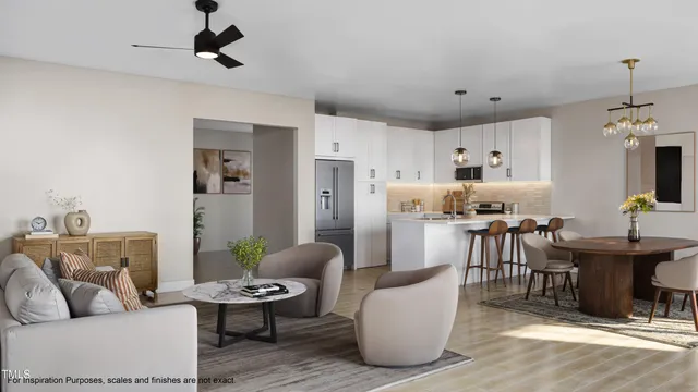a living room with furniture and view of kitchen