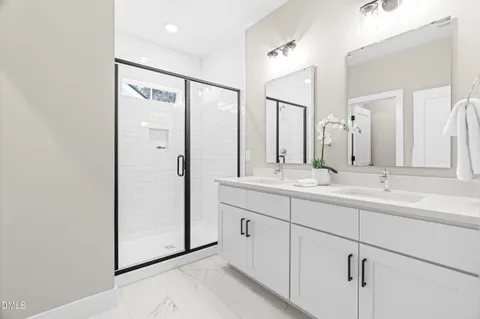 a bathroom with a granite countertop bathtub shower and toilet
